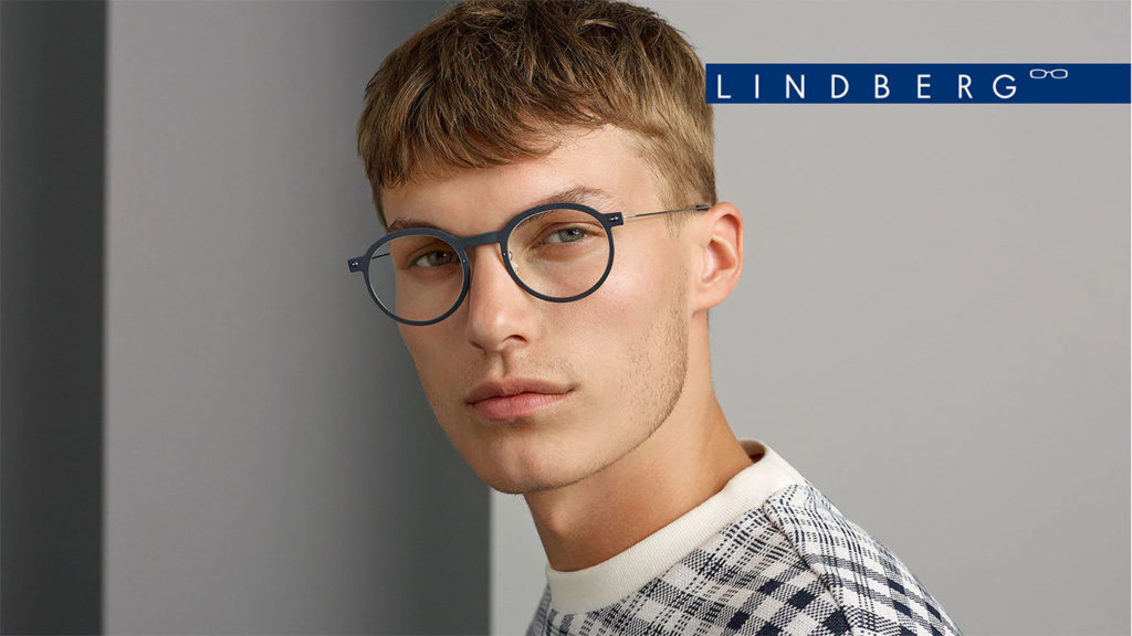Young male model wearing Lindberg glasses.